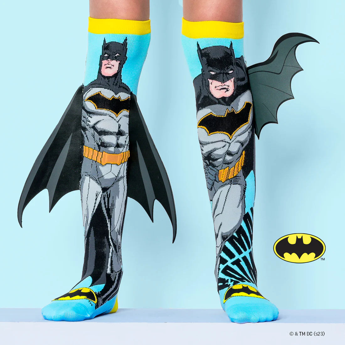 The coolest Batman socks are here.  These incredible superhero socks let you embark on an adventure and transform into a miniature Dark Knight! You may now sport the valor and flair of Gotham City's greatest hero thanks to 3D printed bat wings and the Batman logo.  With a surprise splash of comic book excitement, you can play, explore, and stand out. These socks encourage playfulness and imagination more than only through their appearance!