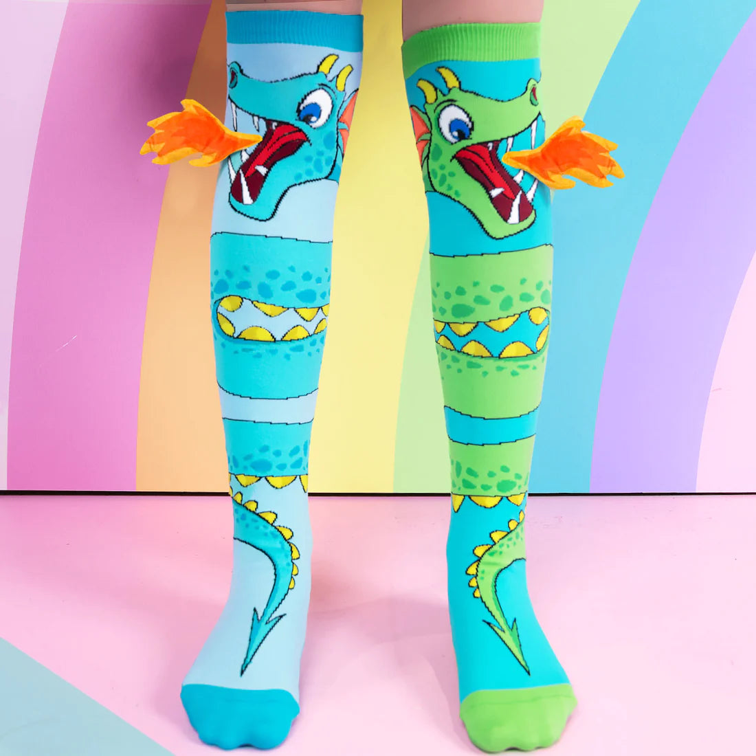 Get ready for an adventure with these epic dragon socks! These fun silly unisex socks feature bold and colorful dragon designs that are sure to spark your sense of wonder. Whether they're pretending to fly through the skies or just lounging around the house, these socks will keep their feet feeling fierce and fabulous. So let your dragon spirit soar with these magical fun kids and adult socks!