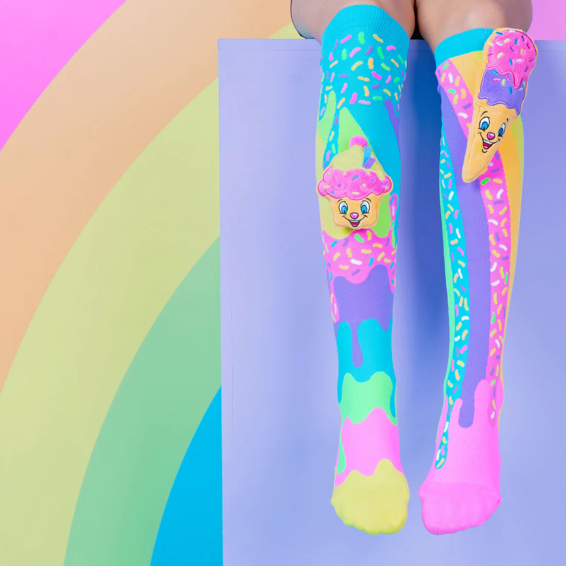 To add a bit of fun and sweetness to your outfit, try our Ice Cream and Cupcake Socks. These amusing socks will brighten up any outfit and make a great impression wherever you go thanks to their distinctive design, which includes a specially created cheerful Cupcake and an attached Ice-Cream plush toy.
