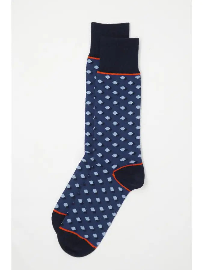 The navy Disruption will cause a commotion in your wardrobe with its light blue polka dots on a darker blue background. These high-quality men's socks are an excellent method to flaunt one's own taste. Supima cotton, used to make these socks, is widely regarded as the best cotton in the world.
