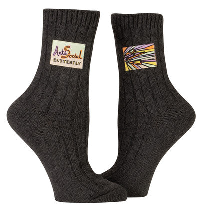 Anti-social butterfly Made with organically grown cotton, plus spandex for stretch, Tag socks look quite refined. But lean in closer and their finely stitched tags crack wise with the best of 'em. These socks are woven thick for that perfect mix of attractive texture and everyday comfy cushion. So cushiony, in fact, you can't even feel the tag.