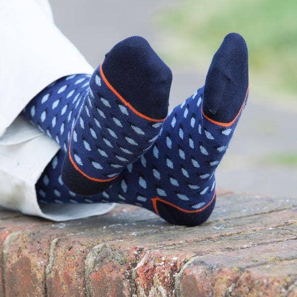The navy Disruption will cause a commotion in your wardrobe with its light blue polka dots on a darker blue background. These high-quality men's socks are an excellent method to flaunt one's own taste. Supima cotton, used to make these socks, is widely regarded as the best cotton in the world.