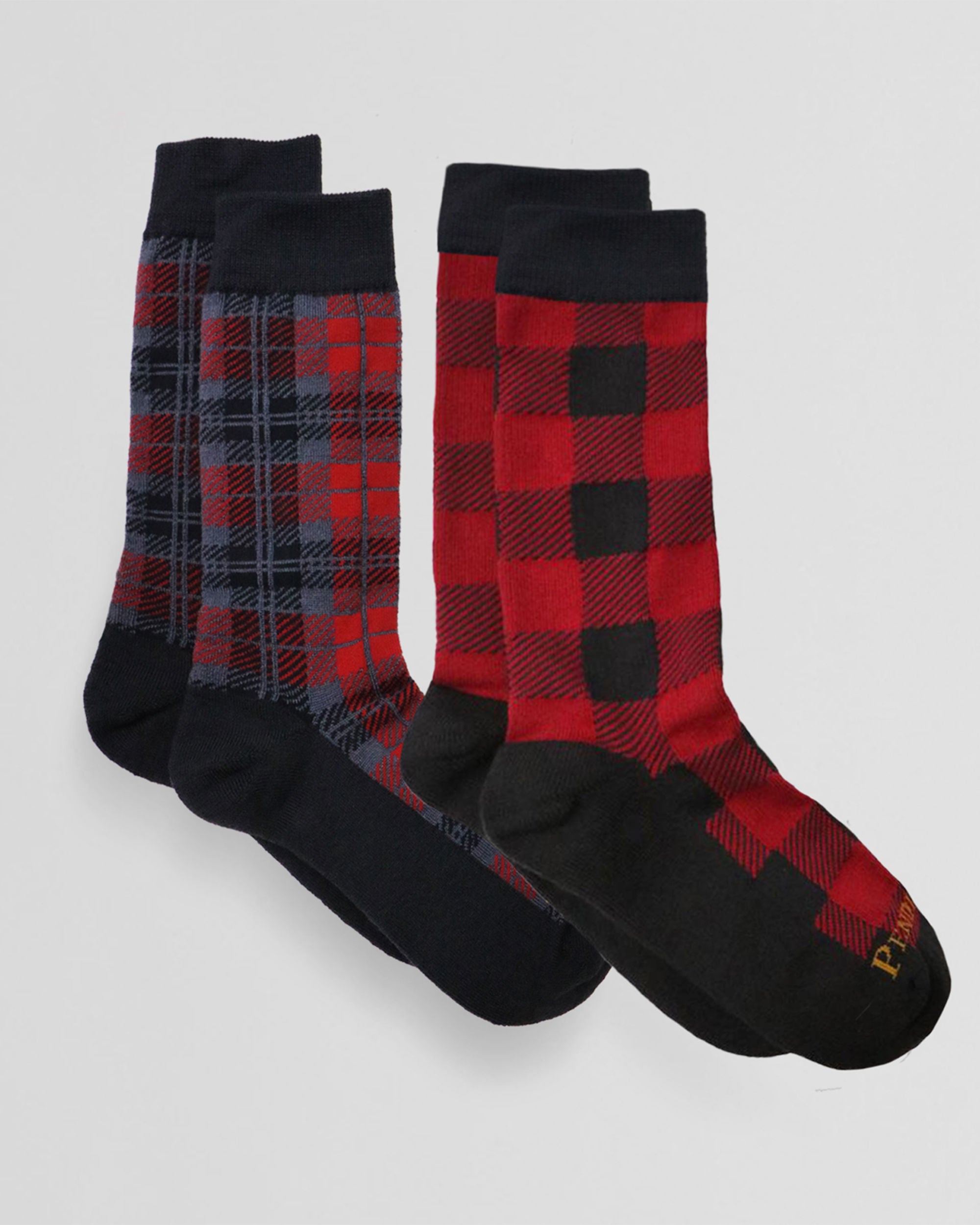 Two pairs of socks in classic plaids, knit from a merino wool blend (30-35%) with gentle leg and ankle compression, arch supports and cushioned footbeds. For men and women.