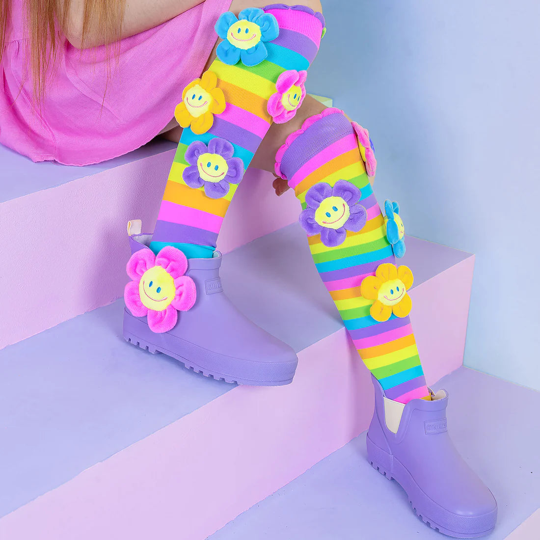 With our vibrant Flower Fun Socks, which include plush flowers manufactured to order, welcome spring!  The flower's vibrant and upbeat colours will add life to any outfit and a hint of spring to your wardrobe all year long.