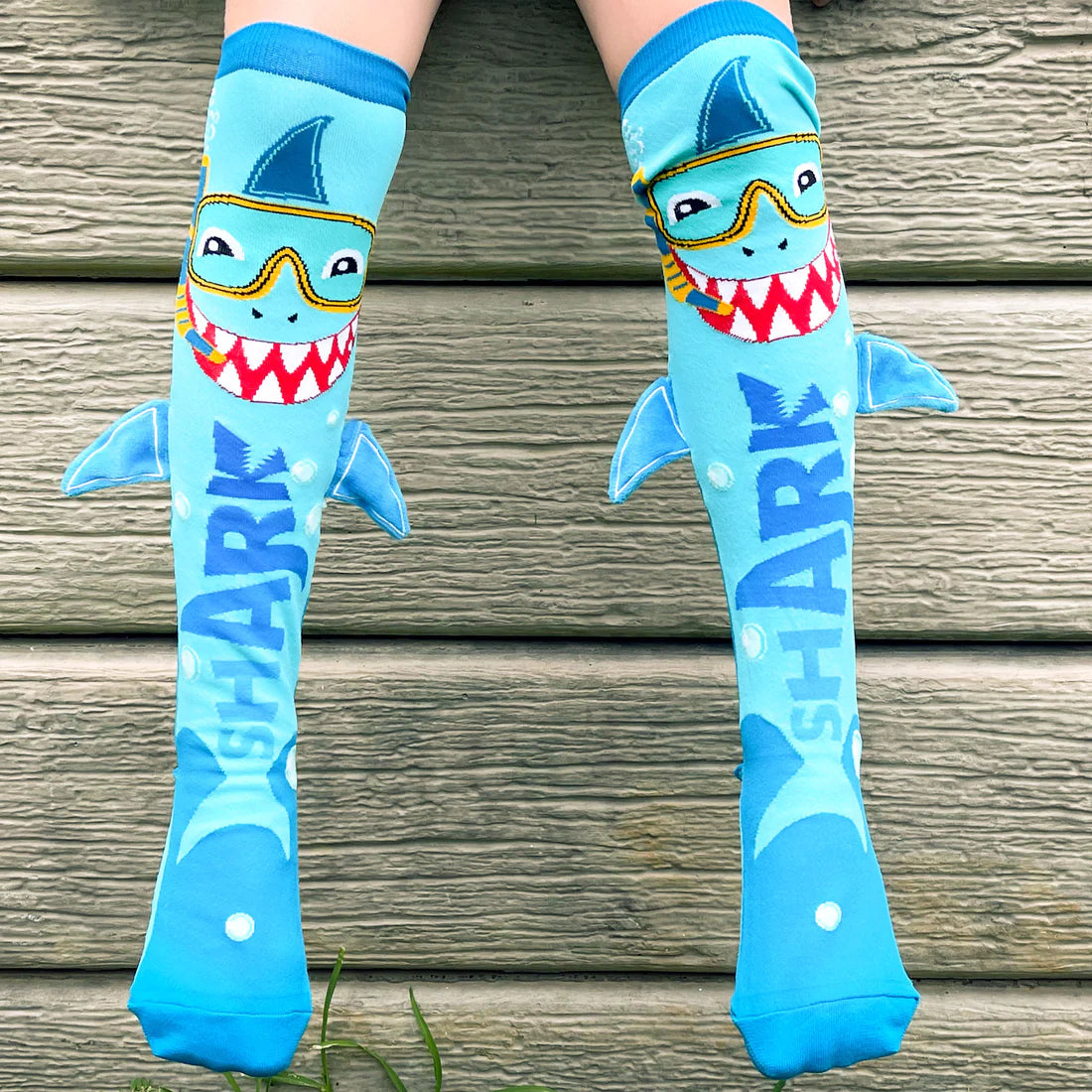 Enjoy a Jawsome Time while exploring the area in our hippest shark-themed Unisex Socks with plush fins.  Let's plunge in and investigate the city like real shark explorers.
