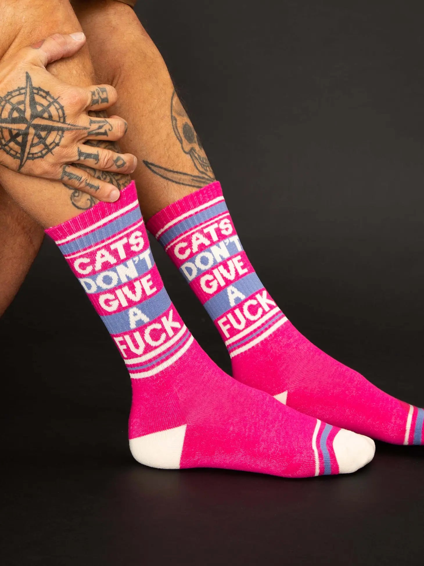 If you've ever tried scolding a cat, you know these are perhaps the most factual socks we've ever created.NOVELTY SOCKS - Cats Don't Give A Fuck Gym Crew Socks