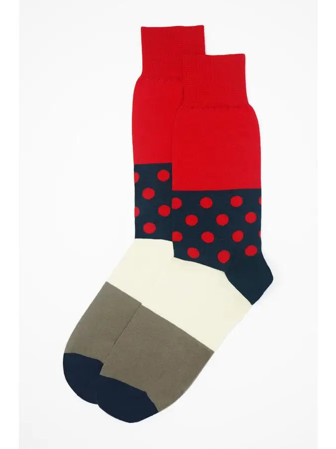 Men, meet the striking scarlet Mayfair socks. These timeless but modern socks will be a great addition to any of his wardrobe staples. These high-quality men's socks are designed for guys who value traditional fashion but also appreciate edgy details, such as the modern polka dots on the crimson red cuff and the sophisticated cream and grey sole. 