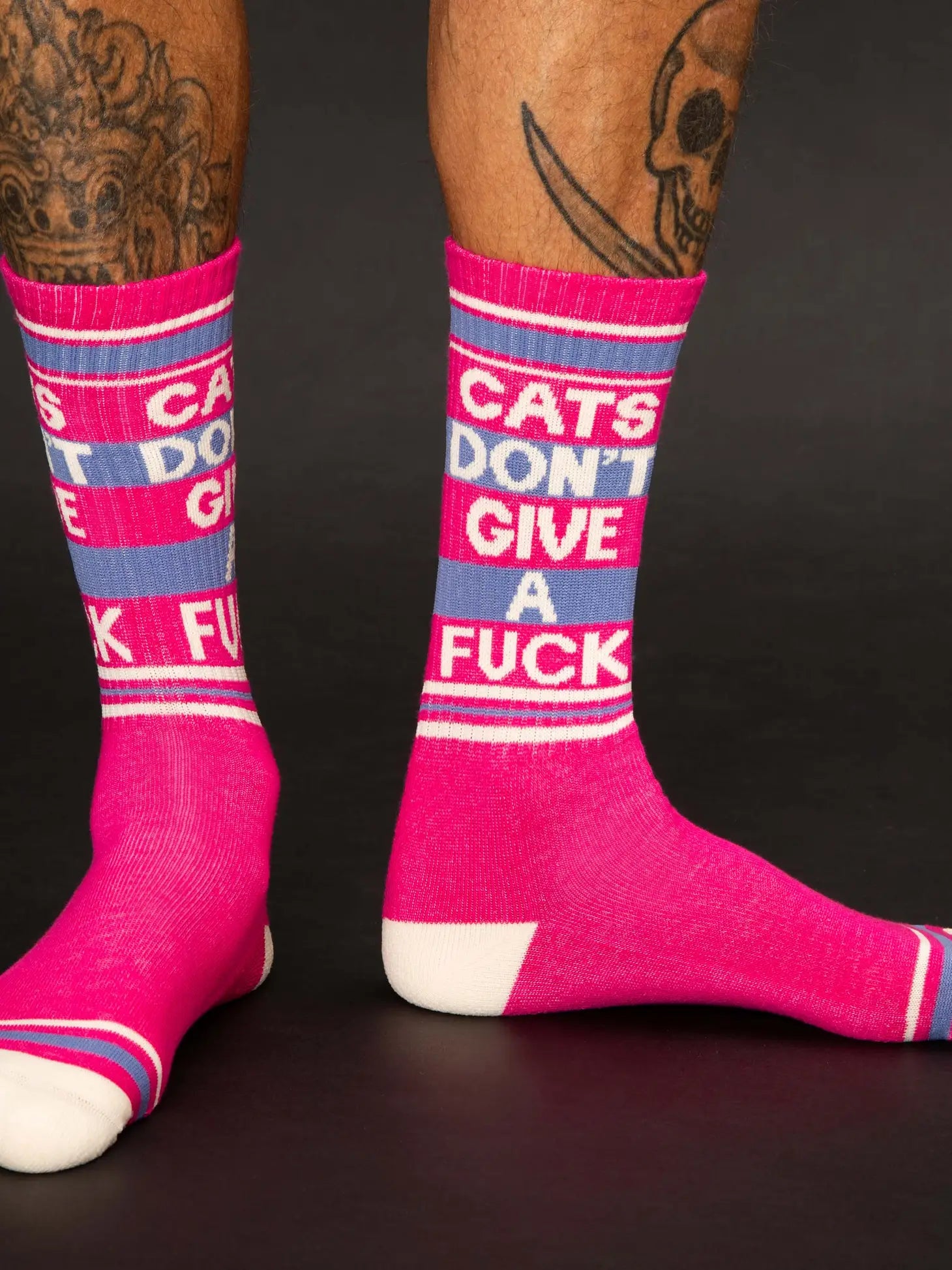 If you've ever tried scolding a cat, you know these are perhaps the most factual socks we've ever created.NOVELTY SOCKS - Cats Don't Give A Fuck Gym Crew Socks